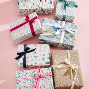 Geschenkpapier | Go Green - Nachhaltige Geschenkverpackung^DecoWoerner Nachhaltiges Kraftpapier Aus Zuckerrüben Mit Rosa, Blauen & Goldenen Geschenken – 50 M Geschenkpapier-Rolle mehrfarbig